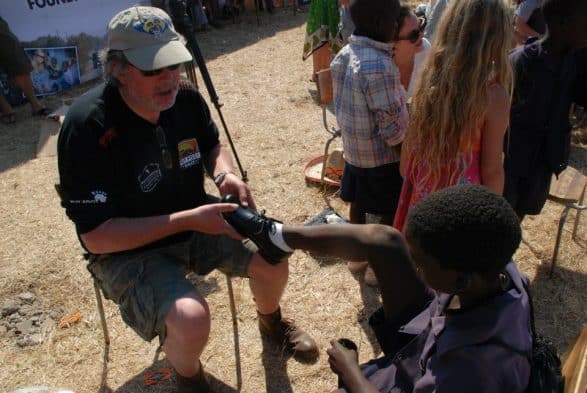 David fitting shoes in Livingston, Zambia